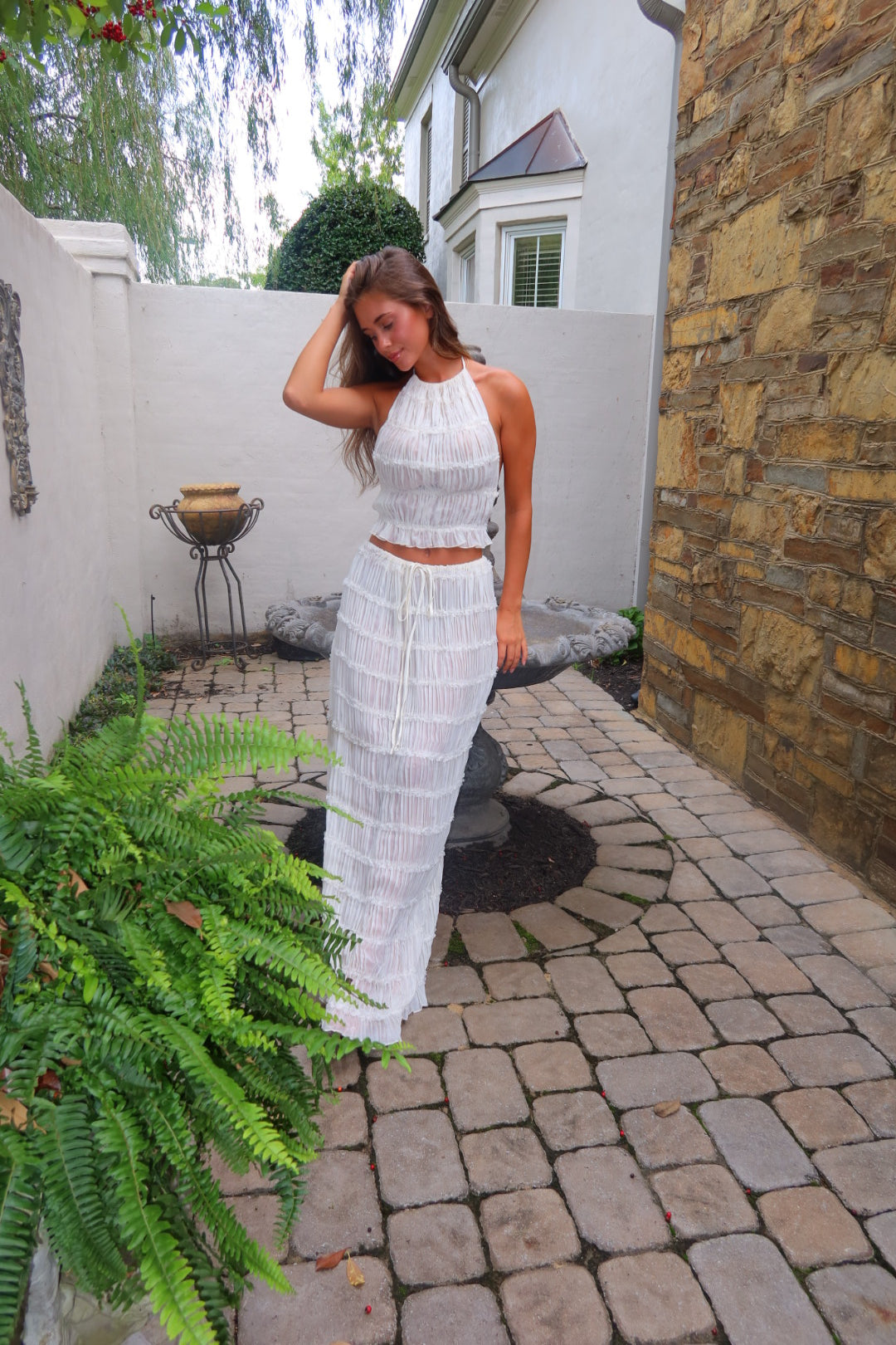 White Shannon Top by Strawberry Paris with pleated detailing and an open back.