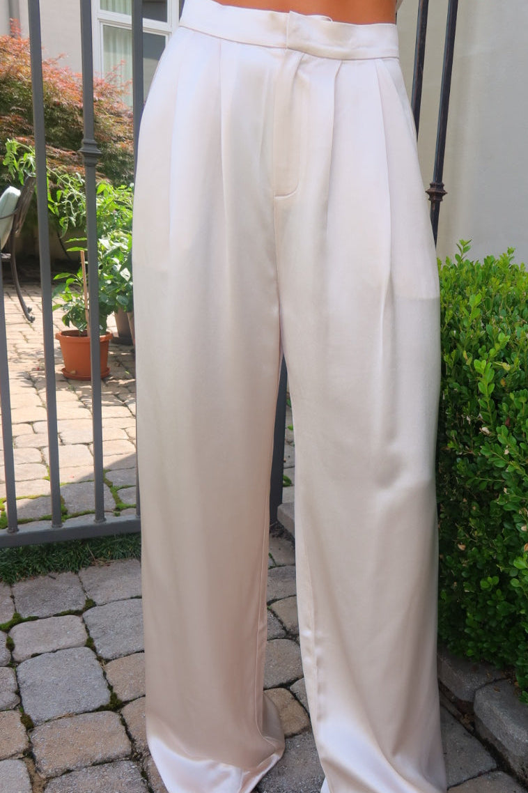 Ivory Ayla Satin Pant by Strawberry Paris with luxe satin fabric and pockets.