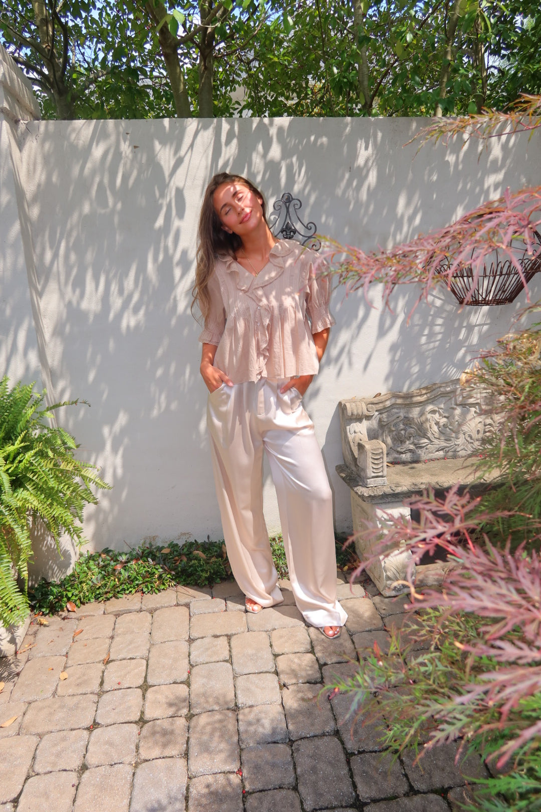 Ivory Ayla Satin Pant by Strawberry Paris with luxe satin fabric and pockets.