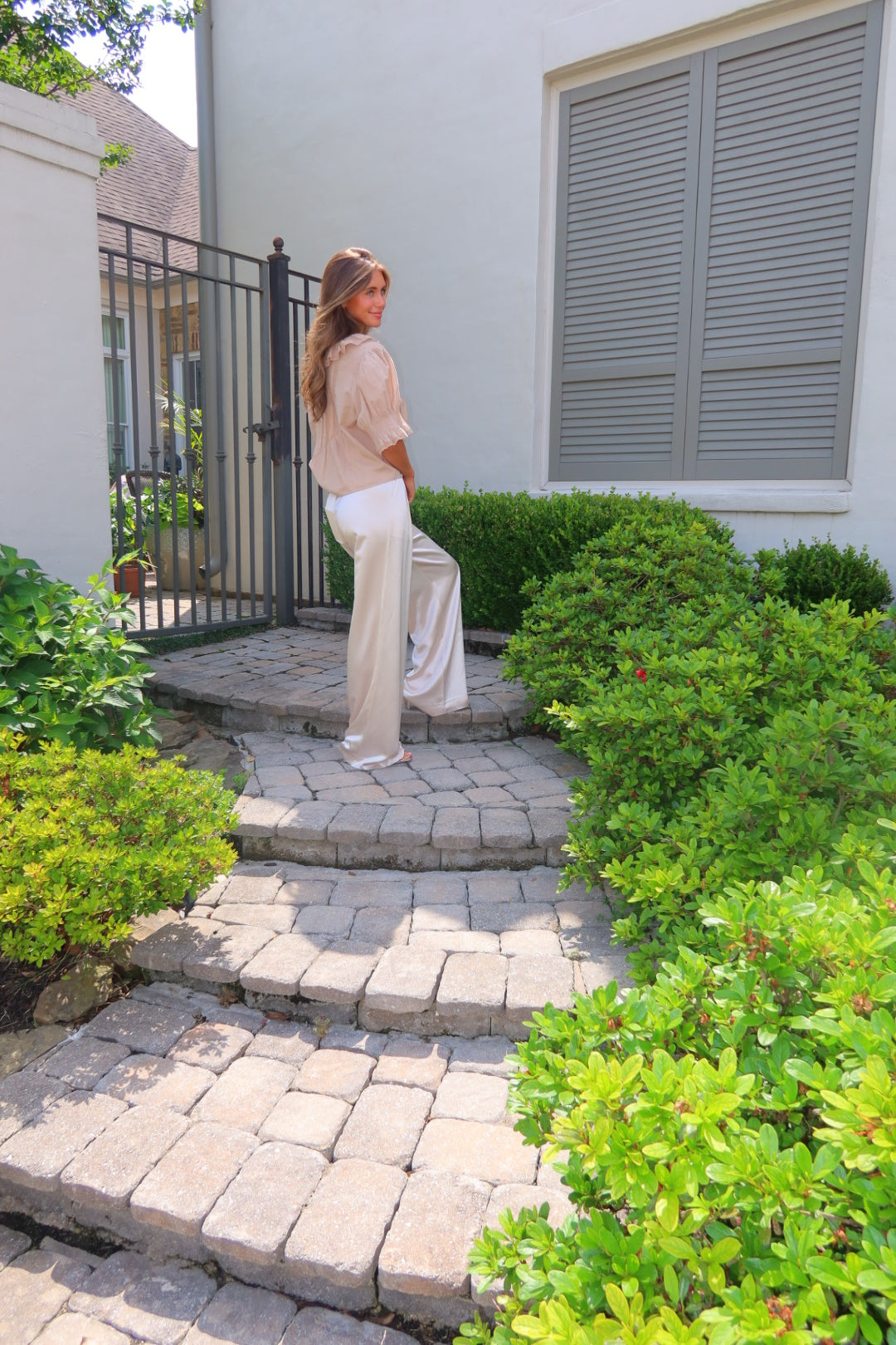 Ivory Ayla Satin Pant by Strawberry Paris with luxe satin fabric and pockets.