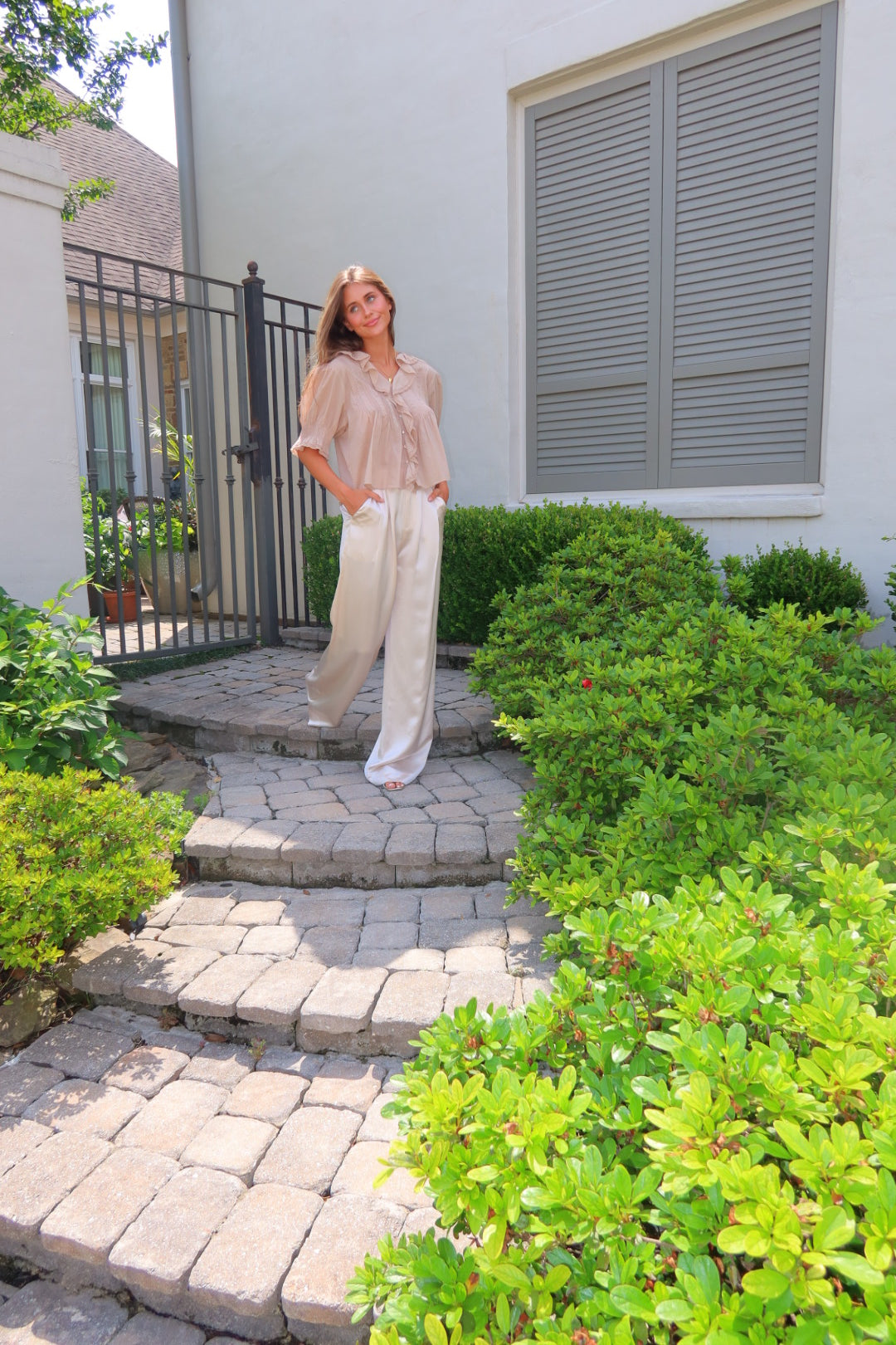 Ivory Ayla Satin Pant by Strawberry Paris with luxe satin fabric and pockets.