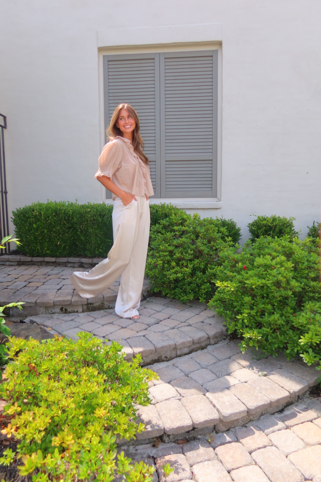 Ivory Ayla Satin Pant by Strawberry Paris with luxe satin fabric and pockets.