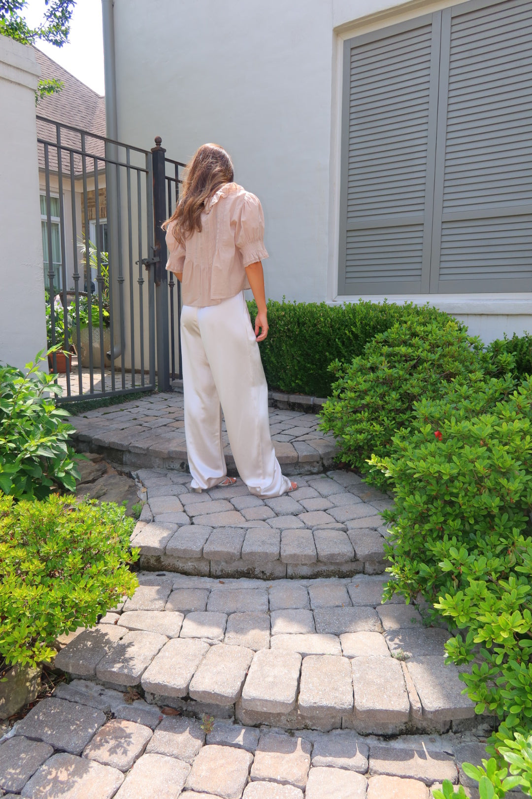 Ivory Ayla Satin Pant by Strawberry Paris with luxe satin fabric and pockets.