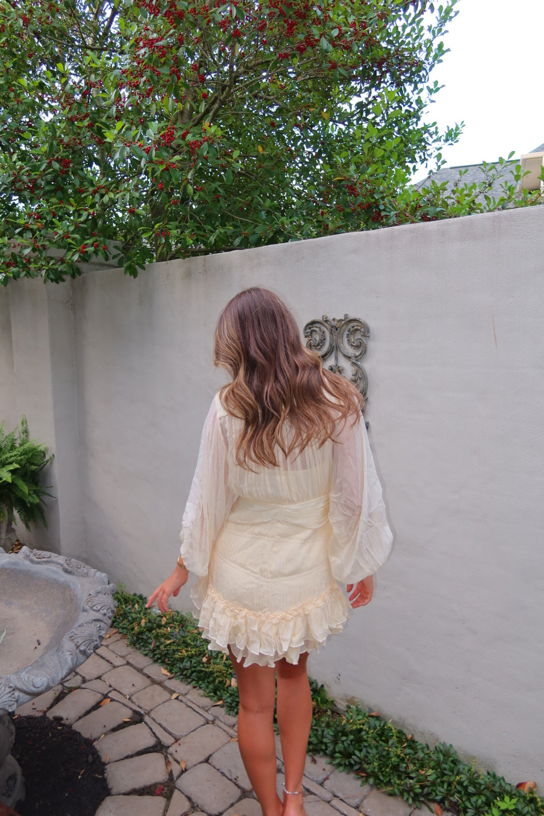 Cream pleated Kayal Dress by Strawberry Paris with button front and built-in cami.